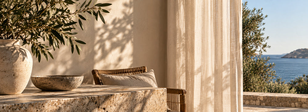 Sunlight, olive branches and natural stone overlooking the sea
